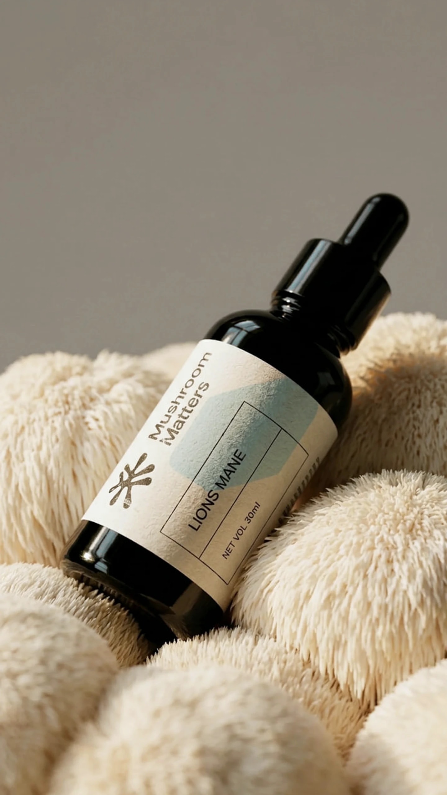 Lion's Mane extract in a 30 ml amber dropper bottle, close up